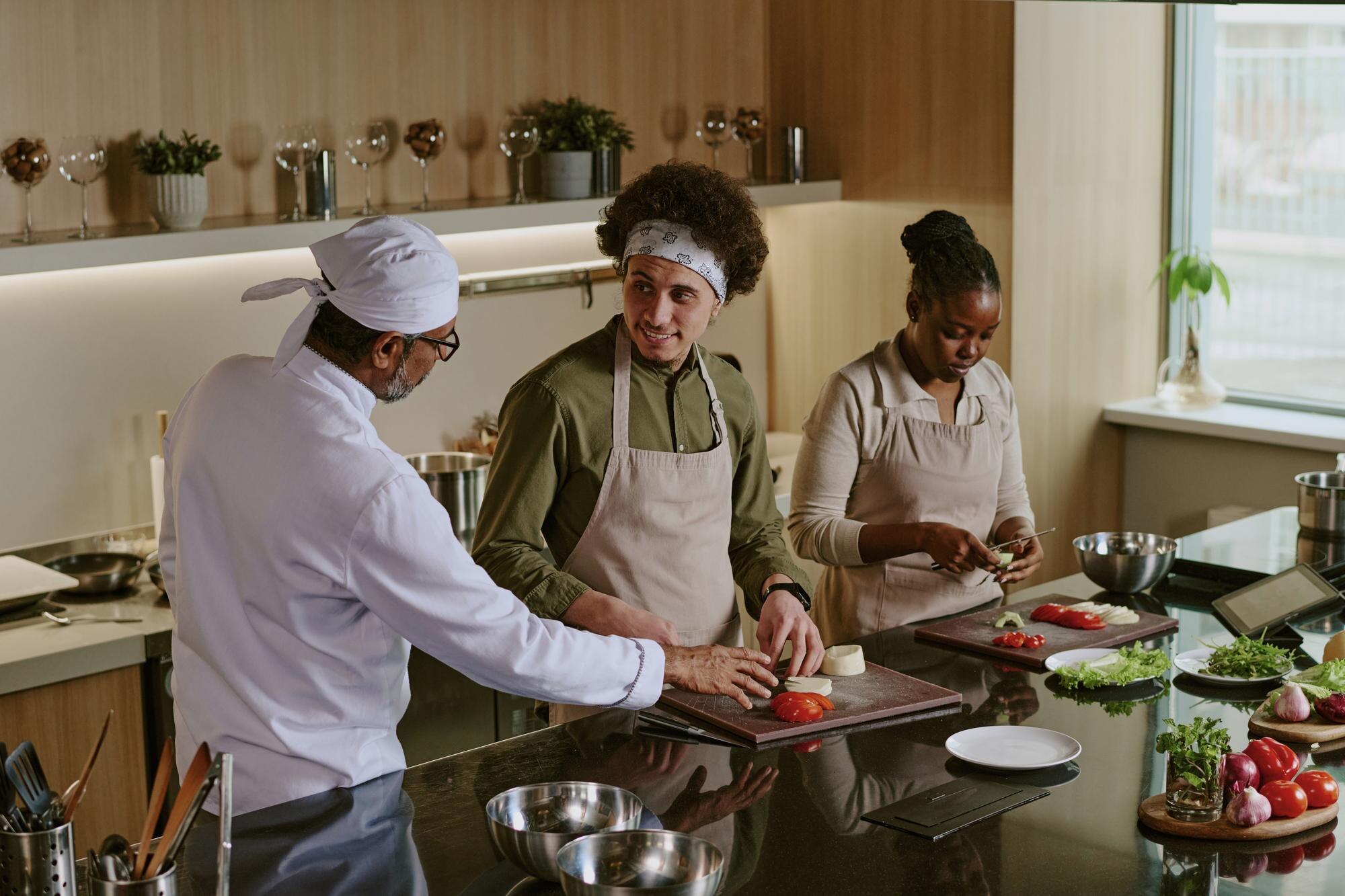 Kitchen team collaborating during busy service